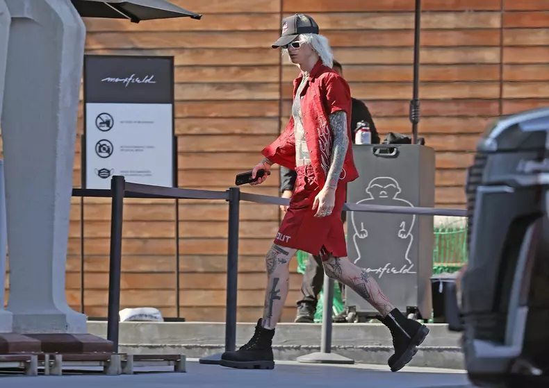 Machine Gun Kelly takes his new customized $355K Rolls Royce SUV on a shopping trip with Mod Sun and a mystery blonde