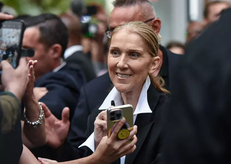 Celine Dion Meets Her Fans Outside Her Hotel In Paris
