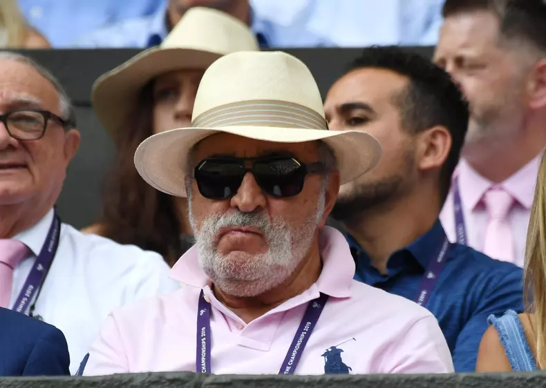 London, UK. 13 July 2019 The Championships Wimbledon 2019
13072019 Billionaire Romanian  Entrepreneur Ion Tiriac, also known as the Brasov Bulldozer  watches compatriot Simona Halep  celebrates as she wins Ladies Singles Final. Credit: Roger Parker/Alamy