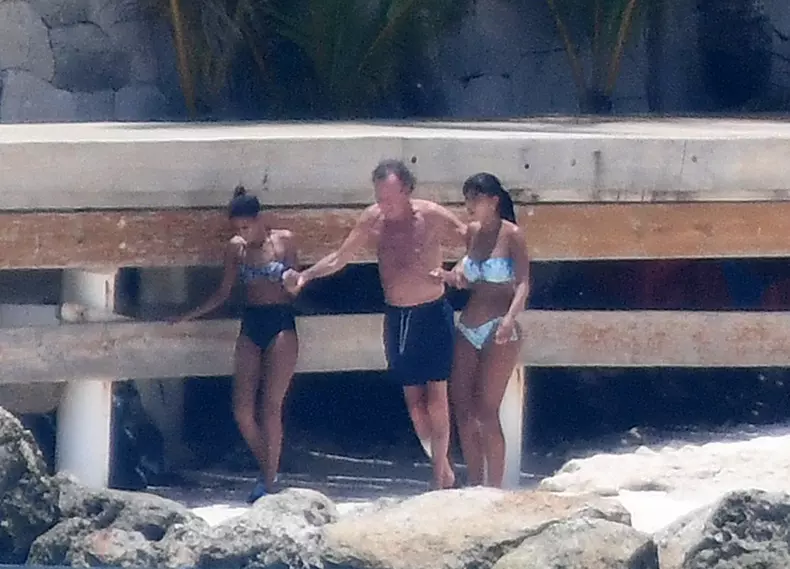 EXCLUSIVE: Julio Iglesias and two bikini-clad companions on the beach in front of his magnificent home in Punta Cana in the Dominican Republic