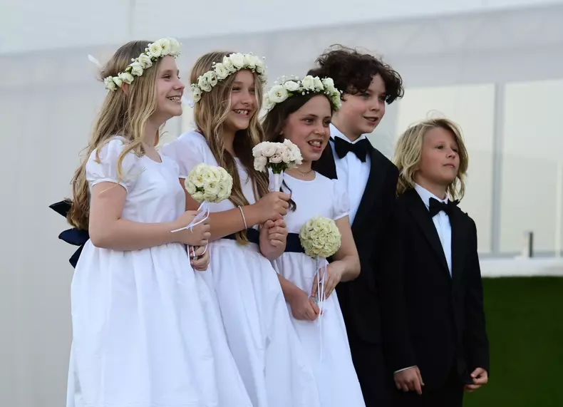 Harper Beckham is seen in her flower girl dress for her brother Brooklyn Beckham and Nicola Peltz wedding in Palm Beach