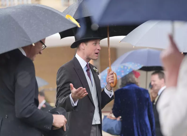Prințul William, în timpul petrecerii Sovereigns Royal Garden Party de la Palatul Buckingham, la Londra.