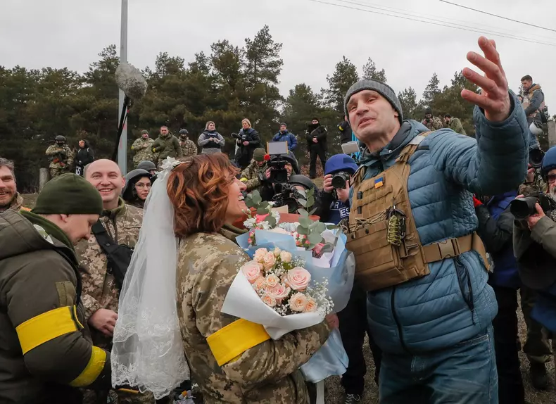 Ukrainian territorial defense fighters tie the knot amid Russian military operation