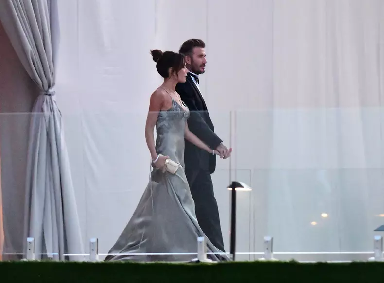 David Beckham and his wife Victoria Beckham enter the dinner tent after their son Brooklyn married Nicola Peltz in Palm Beach