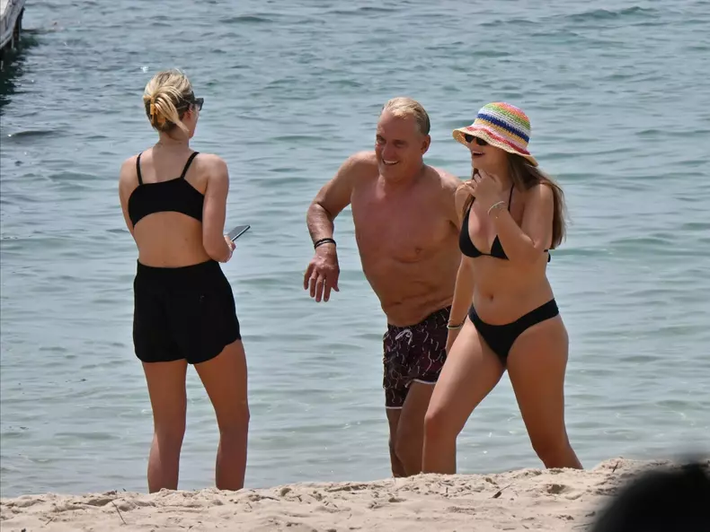 *EXCLUSIVE* WEB MUST CALL FOR PRICING  - 66 year old 80'S movie star Dolph Lundgren is all smiles on the beach with his 27 year old wife Emma Krokdal and 22 year old daughter Greta Lundgren in Sardinia