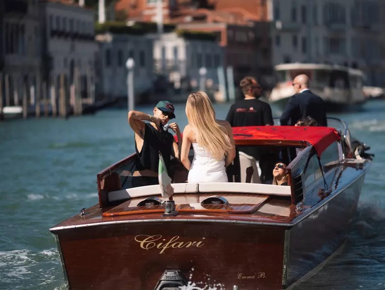 Sydney Sweeney hops on a boat leaving her hotel during Venice Film Festival