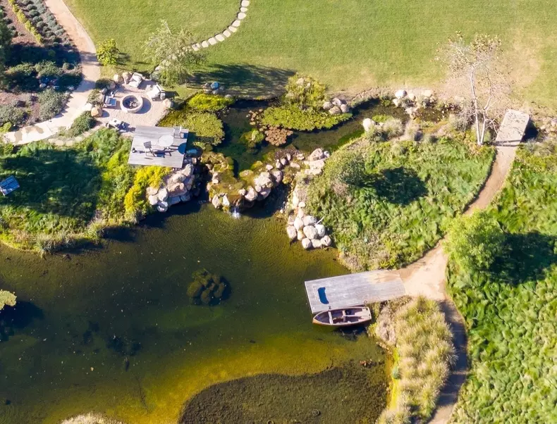 *EXCLUSIVE* Ellen Degeneres and wife Portia De Rossi drop a massive $49 Million on a new compound with 3 houses and a pool house and its very own lake