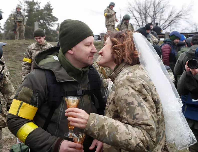 Ukrainian territorial defense fighters tie the knot amid Russian military operation