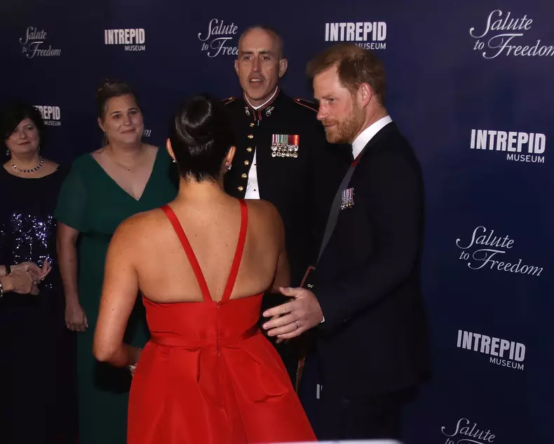 Prince Harry and Meghan Markle smile and laugh with veterans on the red carpet and are very animated as they attend a gala on eve of Veteran's Day in NYC