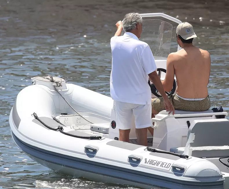 *EXCLUSIVE* Blind Italian operatic tenor Andrea Bocelli gets tender help from his son Matteo Bocelli to board a boat in Forte dei Marmi