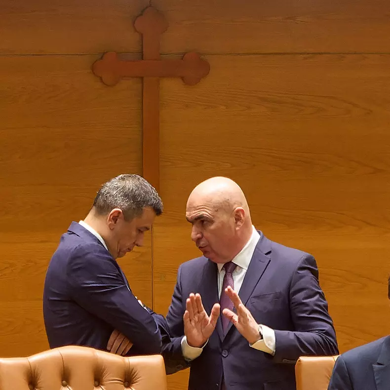 Bucharest, Romania. 1st Sep, 2025: Romanian Prime Minister Ilie Bolojan (R) speaks to Sorin Grindeanu (L), president of the Chamber of Deputies and interim president of the Social Democratic Party (PSD), during the joint plenary session of Parliament as t