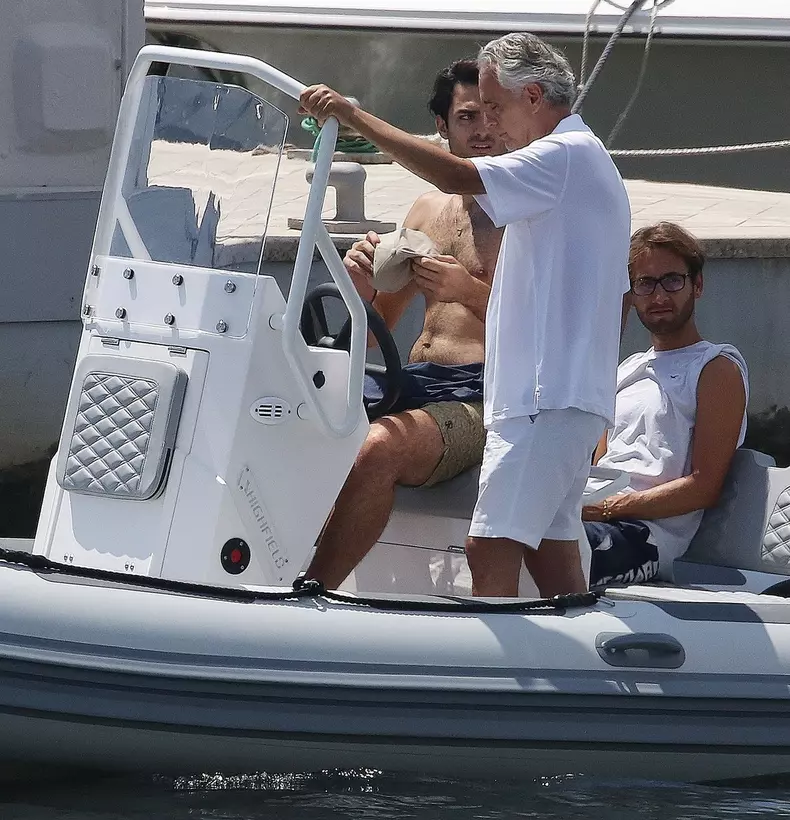 *EXCLUSIVE* Blind Italian operatic tenor Andrea Bocelli gets tender help from his son Matteo Bocelli to board a boat in Forte dei Marmi