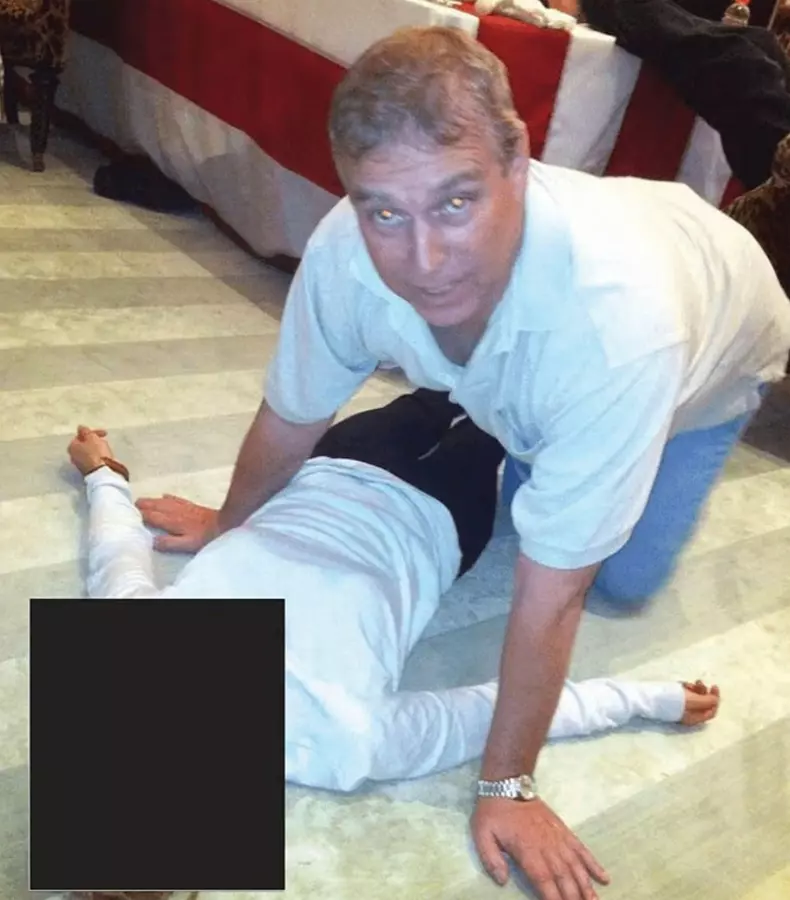 ANDREW MOUNTBATTEN-WINDSOR As Prince Andrew with an unidentified woman in an undated  photo from the Epstein files released by the US Department of Justice in February 2026
