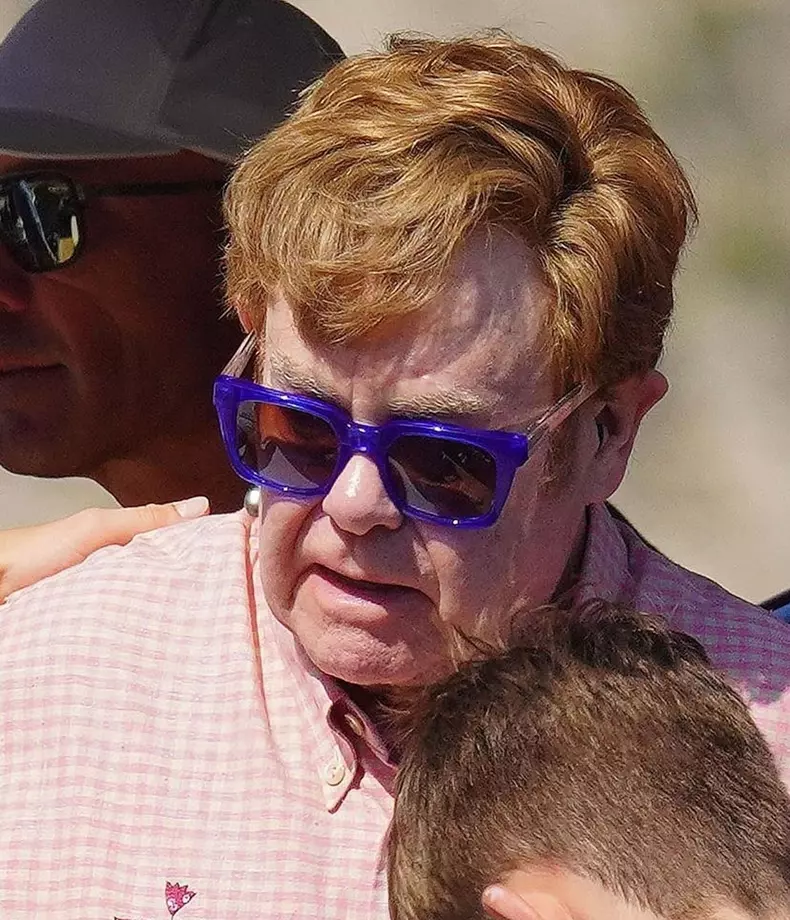 *EXCLUSIVE* *WEB MUST CALL FOR PRICING* After a little help from his friends by getting on his luxurious yacht, Sir Elton John cuts some style with his expensive looking watch as the star takes in the French sunshine on holiday in St Tropez.