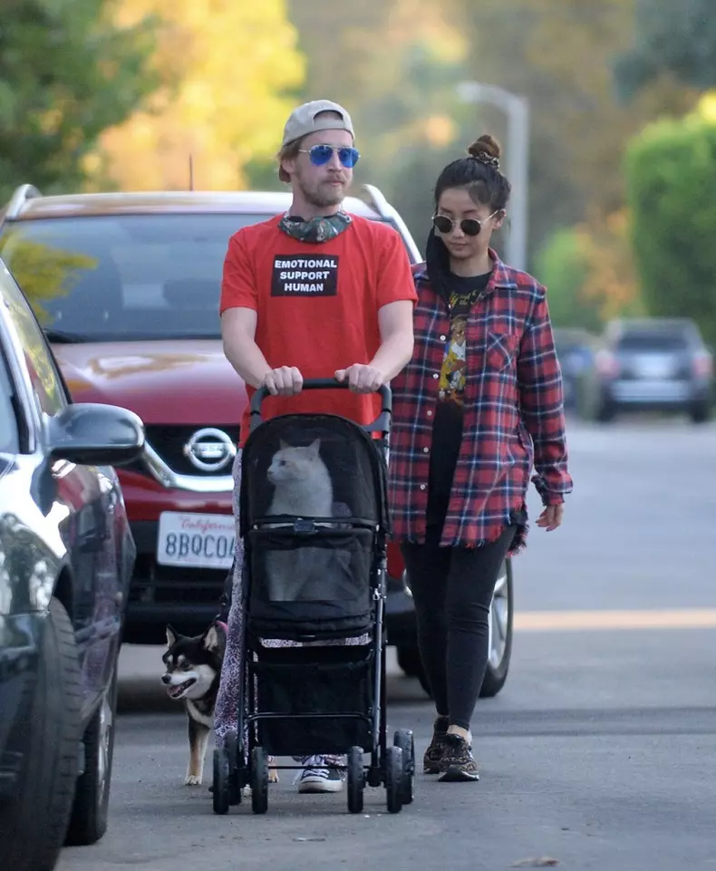 EXCLUSIVE: Macaulay Culkin and Girlfriend Brenda Song Take Their Cat and Dog Out for a Stroll in Los Angeles.