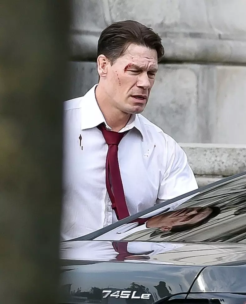 *EXCLUSIVE* A bloodied John Cena was pictured leaving the Heads of state film set in Liverpool with blood on his shirt and a cut eye.