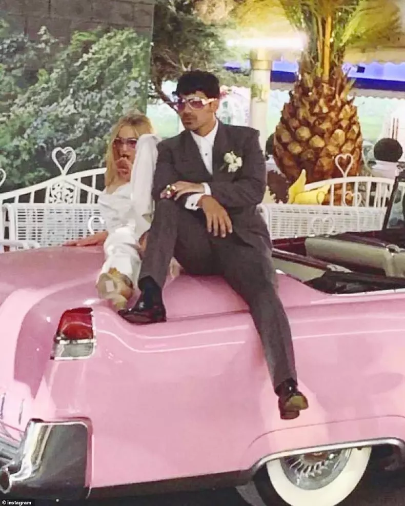 12991726-6983625-Mr_and_Mrs_Joe_Jonas_Photos_of_the_newlyweds_posing_on_the_hood_-a-5_1556781180869