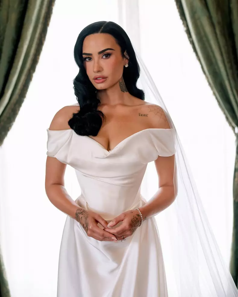 Demi Lovato and Jordan “Jutes” Lutes are officially married! The couple's wedding took place in California this weekend, with @ddlovato wearing a pearl-white, corseted @VivienneWestwood dress. “When I was t