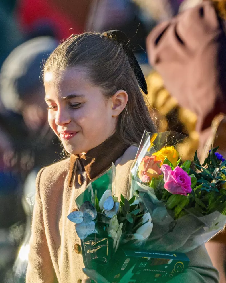 25 Dec 2025. Sandringham, Norfolk UK. Princess Charlotte receives flowers from well-wishers on leaving St. Mary Magdalene Church on the Sandringham Estate after attending the Christmas morning service.