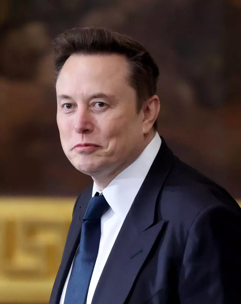 Elon Musk Holds His Phone At Trump Inauguration - DC