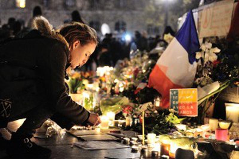 People gather in tribute to the victims of the attacks in and around Paris, at the Place de la Republique in Paris, France, on November 15, 2015. At least 132 people have been killed and over 250 injured, 96 of which seriously wounded, after a series of terrorist attacks in the French capital. Photo by Aurore Marechal/ABACAPRESS.COM