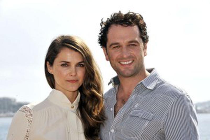 MIPCOM 2012 (Marche International des Contenus audiovisuels) a Cannes le 8 octobre 2012 - British actor Matthew Rhys (R) and US actress Keri Russell (L) pose during the photocall for the TV series 'The Americans' at the annual MIPCOM television programme market in Cannes, southern France, 08 October 2012. The international film and programme market for TV, video, cable and satellite (MIPCOM) is held from October 8 to October 11 on the French Riviera.