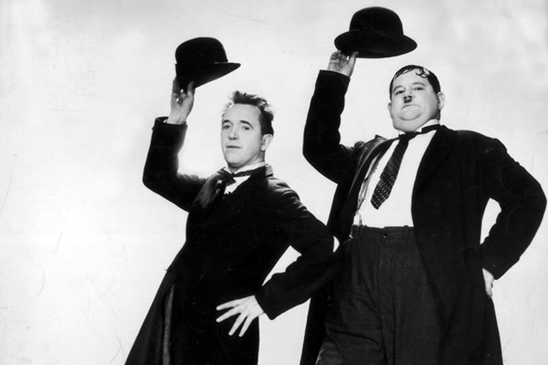 Stan Laurel (1890 - 1965) and Oliver Hardy (1892 - 1957) in a dance routine from the film 'Way Out West', directed by James Horne. (Photo by Hulton Archive/Getty Images)