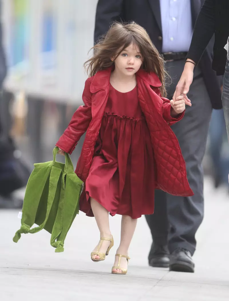 Exclusive – Suri Cruise Shows off Her Red Dress