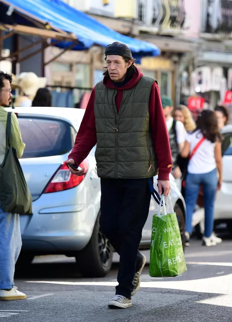 *EXCLUSIVE* Christopher Brosnan is spotted on a stroll holding his Waitrose bag out shopping on the Portobello Road in London’s Notting Hill.