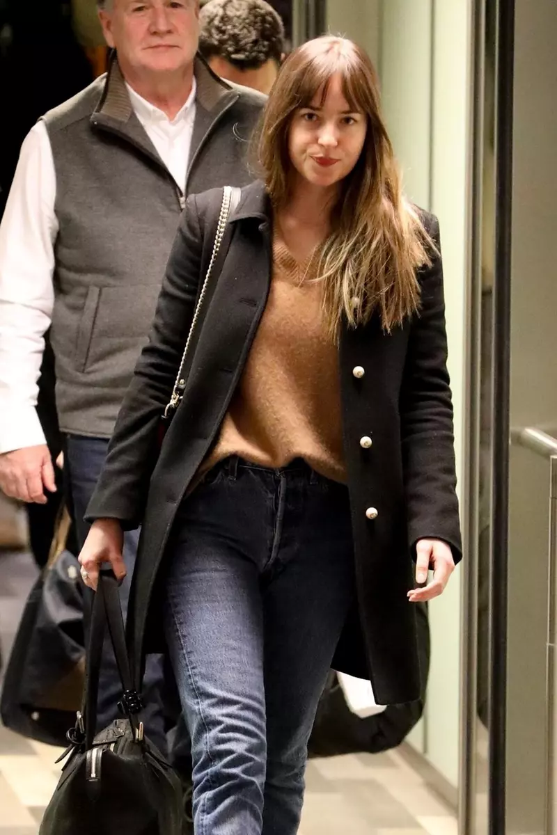 *EXCLUSIVE* Dakota Johnson arrives solo in Colorado after spending time Chris Martin in Paris