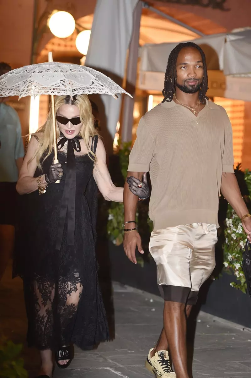 Pop legend Madonna shopping at Dolce & Gabbana with her rumoured new beau 28-year-old Akeem Morris while on holiday in Portofino ahead her 66th birthday celebrations