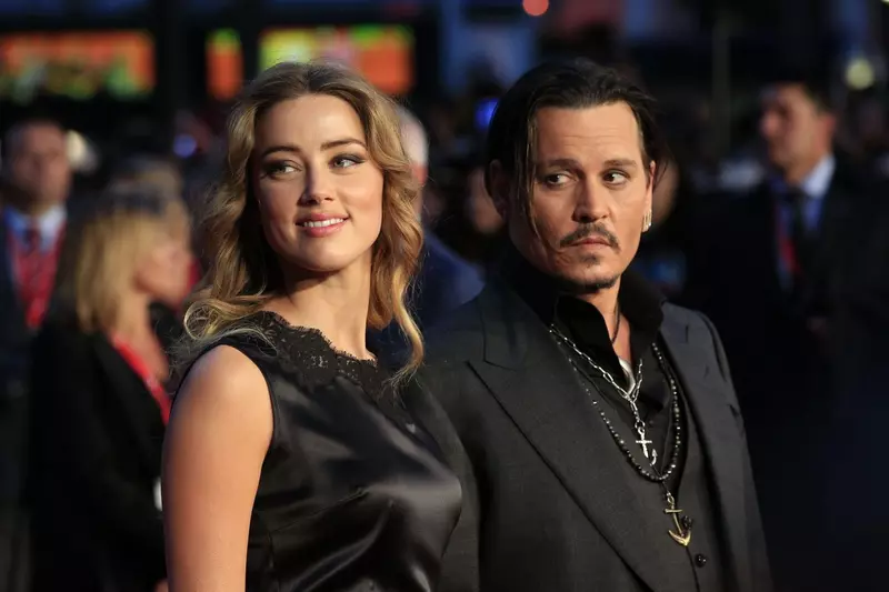 File photo dated 11/10/2015 of Amber Heard and Johnny Depp attending the premiere of Black Mass during the 59th BFI London Film Festival at the Odeon Leicester Square, London. Johnny Depp has said he "feels at peace" and is "truly humbled" after winning h