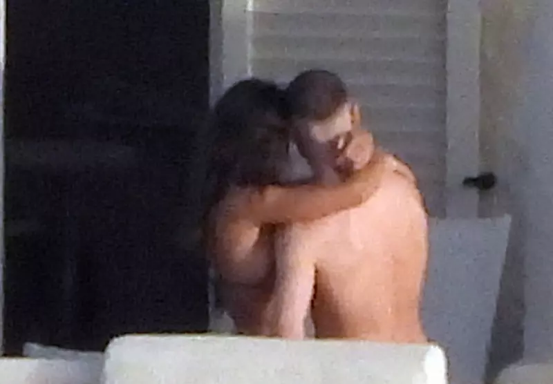 EXCLUSIVE: Elisabetta Canalis in a bikini and boy-friend Georgian Cimpeanu taking selfies on their room’s balcony in Vulcano, Eolian Islands