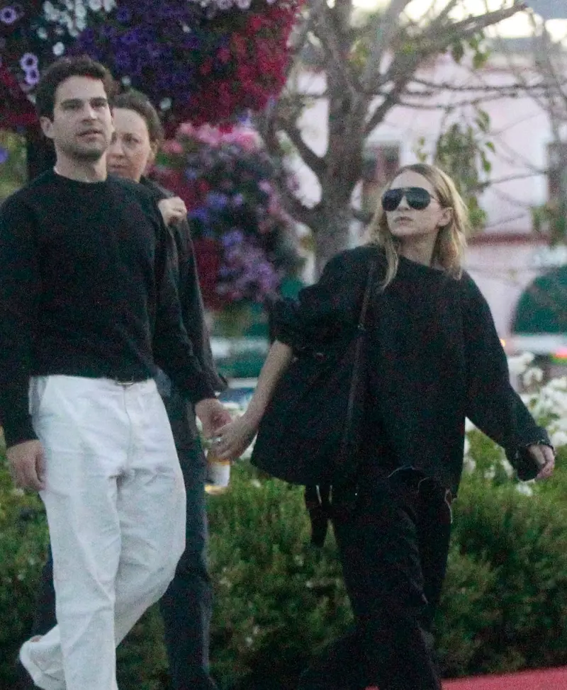 Ashley Olsen shows off a mystery engagement band while out with her Artist boyfriend Louis Eisner